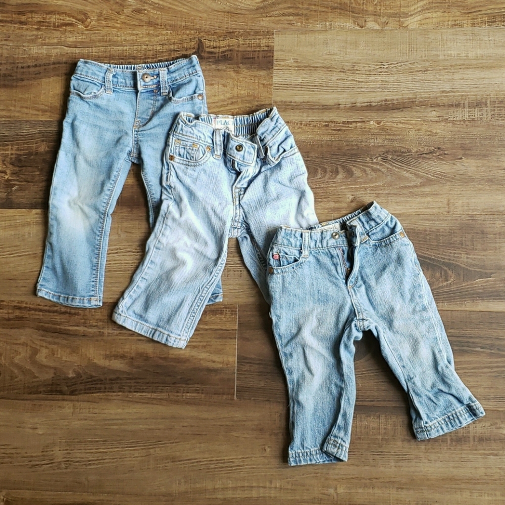 Three pairs of light wash baby jeans